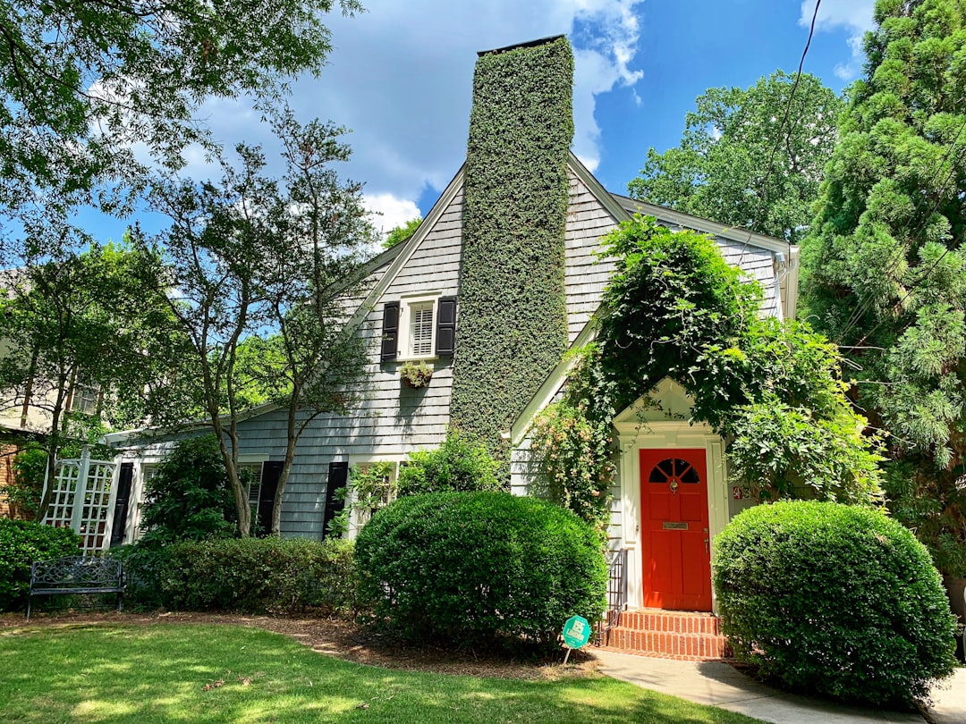 Beautiful, modern home in an Atlanta neighborhood under a bright, sunny sky, representing the local real estate market.
